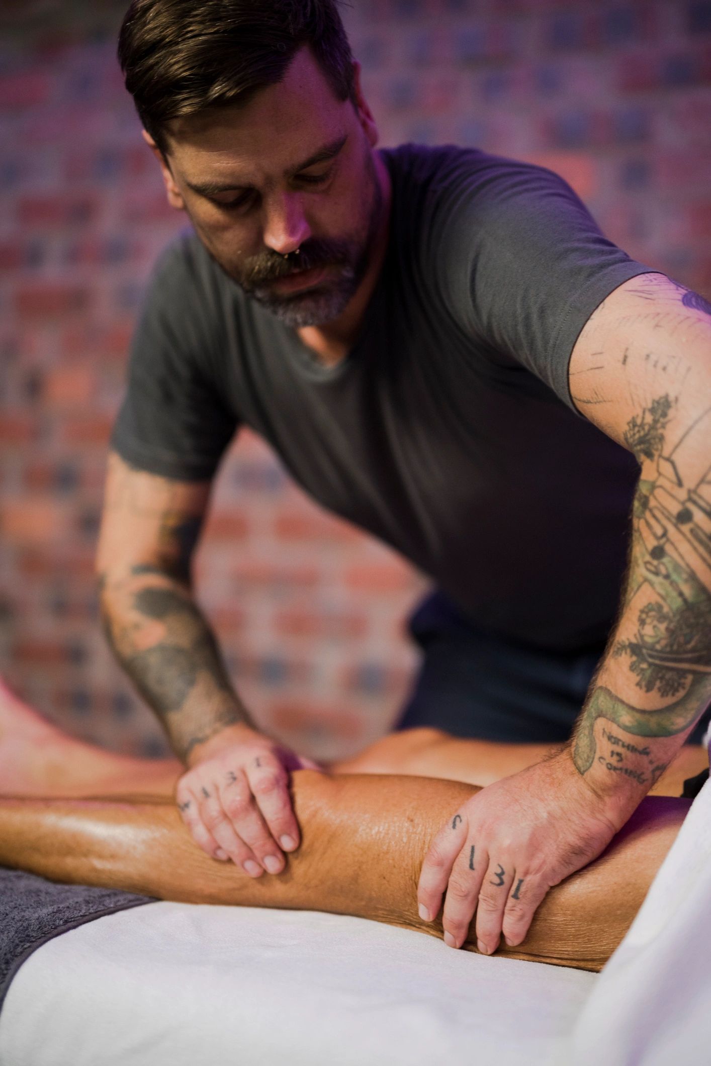 Massage therapist providing focused wellness care